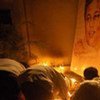 Mourners light candles near a portrait of Lasantha Wickrematunge (file)