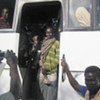 Nyatet Mokol, the 20,000th Sudanese refugee to return home from Uganda, on the bus that took her there