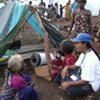 A UNHCR staff member talks to displaced people in northern Sri Lanka