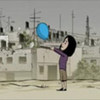 Still from film showing child releasing blue balloon