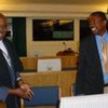 Former Rwandan Acting Interior Minister Callixte Kalimanzira (right), with his duty counsel Apolo Maruma in this 14 November, 2005 photo