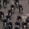 Iranian police on motorbikes patrol a street in Tehran