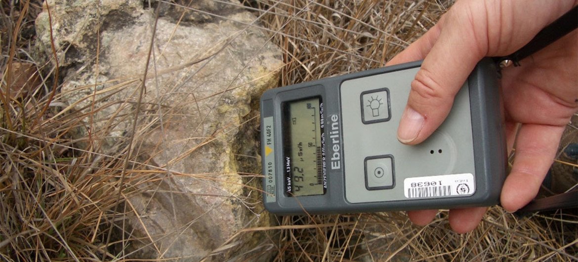 Measuring radiation-contaminated soil.