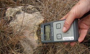 Measuring radiation-contaminated soil.