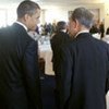 Secretary-General Ban Ki-moon (right) speaks with President Barrack Obama at the working breakfast of the G8 leaders