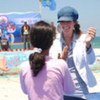 UN aid worker Johanne van Dijk chats with a participant at the Gaza Summer Games