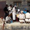 Yemenis uprooted by conflict in the north queue for registration for humanitarian aid