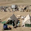 Refugees in their special tented camp in remote and desolate region