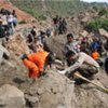 Rescue teams in  West Java, Indonesia, one day after the magnitude 7.0 quake struck