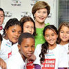 Former First Lady of the United States Laura Bush pose with children