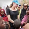 UNHCR Goodwill Ambassador Angelina Jolie (in blue cap) meets Somali refugees in Dadaab