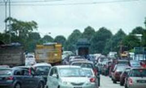 A traffic jam with many cars on a highway.