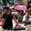 People wading through flood water from Typhoon Ondoy in the Phillipines capital Manila