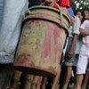 Survivors line up for water at a community wiped out by devastating floods by Ketsana in the Philippines capital Manila