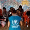 UNHCR staff member interviews asylum-seekers