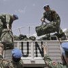 Chinese engineers working for UNAMID unloading their equipment kits