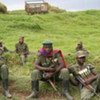 FARDC troops rest outside the MONUC Mobile Operating Base in North Kivu, DRC