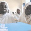 Two girls pause during their studies in a UNICEF-supported school in rural North Darfur