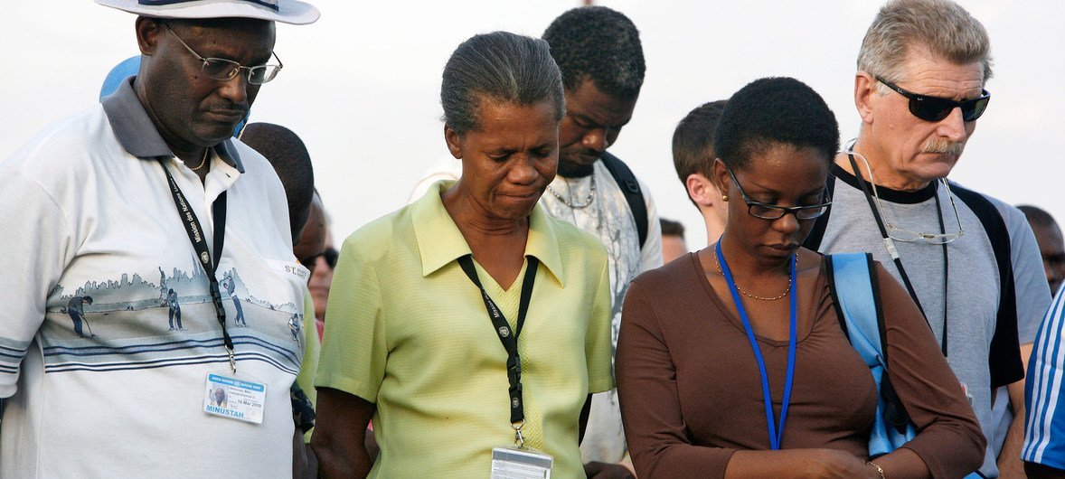 Staff members from the UN Stabilization Mission in Haiti (MINUSTAH) observe a moment of silence for their fallen colleagues during a memorial service in Port-au-Prince, Haiti.