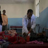 A doctor examines a Somali refugee at a UNHCR-funded clinic in Ethiopia