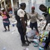 Haitian police check bags in downtown Port-au-Prince
