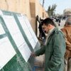 Kurdish voter looking for his name on the voters' lists outside the polling centres in Erbil, Iraq