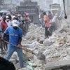 Haitian workers clearing rubble in Port-au-Prince