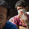 Mother and son waiting for the results of TB tests in the Philippines