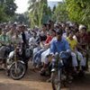 Garment workers going home on motorcycles in Cambodia [File Photo]