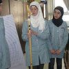 Palestinian girls with prototype electronic cane that will be exhibited at Intel science fair in California