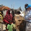 Deputy High Commissioner for Refugees, T. Alexander Aleinikoff, talks to IDPS at a camp in Bossaso, Somalia