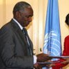 Navi Pillay (right) signs ‘host country agreement’ with Guinea’s junior Foreign Minister Bakary Fofana