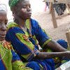 Women pounding rice in Burkina Faso