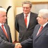From right: Greek Cypriot leader Demetris Christofias, Alexander Downer and Turkish Cypriot leader Dervis Eroglu