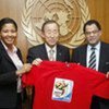 Secretary-General Ban Ki-moon (centre), with jersey of the 2010 World Cup in South Africa in this October 2009 photo
