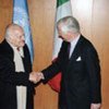 Under-Secretary-General Marrack Goulding (right) greets President Oscar Luigi Scalfaro of Italy on 3 April 1996