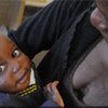 At the Chelstone Clinic in Lusaka, Zambia, HIV-positive Natasha and her one-year-old son, Fanwick, wait for his HIV test