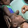 A child receives polio vaccine