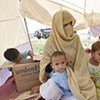 Victims of the devastating floods in Pakistan's Nowshera district now live in makeshift tents.