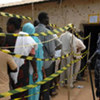 People outside a polling station for the elections in April 2010 in Sudan