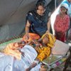 Midwife Farzana Sarki delivered Noor Bano's baby in a tent at a camp for flood victims in Pakistan