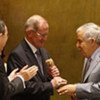 Ali Treki (right), outgoing President of the  General Assembly, passes the gavel to his successor Joseph Deiss. Secretary-General Ban Ki-moon applauds