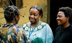 A mental health counsellor talks with clients in the Democratic Republic of the Congo.