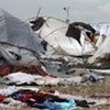 A deadly rainstorm lashed Haiti's capital, Port-au-Prince, on 24 September 2010 leaving people in urgent need of shelter materialAt least 1 million people are still living in tent camps or makeshift housing