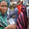 Guineans waiting to vote in the first round of polling 27 June 2010