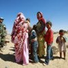 A member of MINURSO's Military Liaison Office chats with a group of Western Saharans