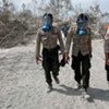 Rescue workers arrive at the scene of the Mount Merapi volcano in Indonesia