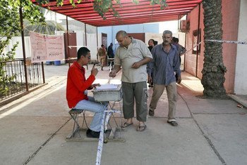Voting at a Baghdad polling station in Iraq's parliamentary elections on 7 March 2010.