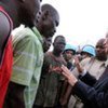 Special Envoy Y.J. Choi (right) speaks with injured pro-Alassane Ouattara supporters in Abidjan