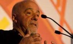 Portuguese politician José Carlos Coelho speaks at a podium during a political event.